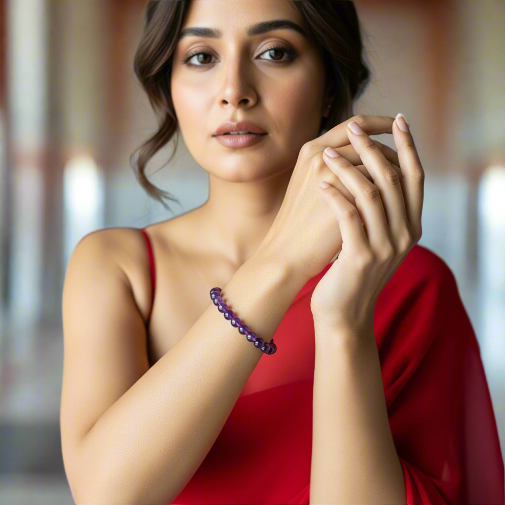 Woman wearing a red dress and purple bracelet in a bedroom setting